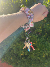 Load image into Gallery viewer, Feather Scrunchie Wristlet
